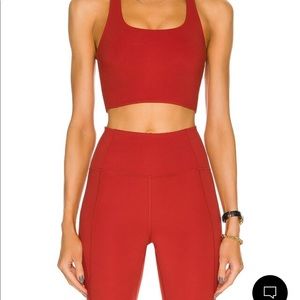 Girlfriend collective Paloma bra and high rise leggings set in brick red